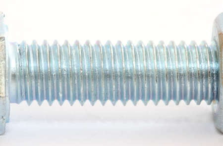 Single metal screw bolt thread part on white backgroundの写真素材