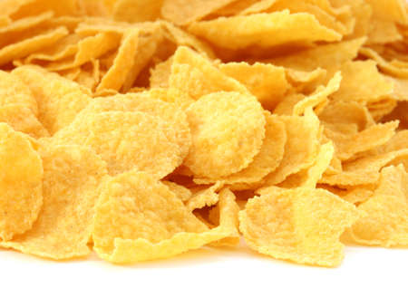 Corn flakes scattered on white backgroundの写真素材