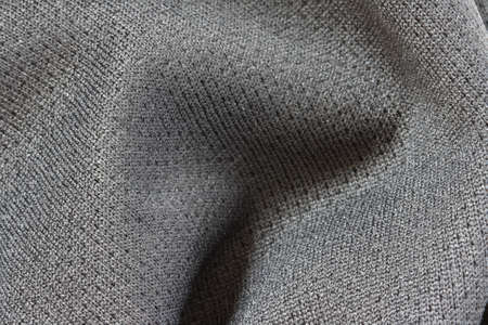 Close up view of dark grey outdoor fabric cloth textureの写真素材