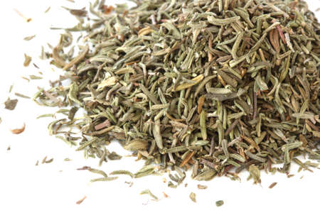 Close up view of scattered pile of rhyme spice on white background