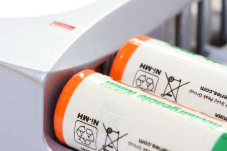 Detail view of battery charger with two batteries chargingの写真素材