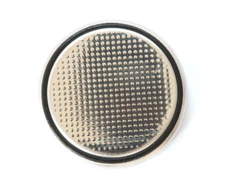 Silver button cell battery on white backgroundの写真素材