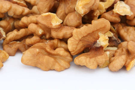 Halves of walnuts on white backgroundの写真素材