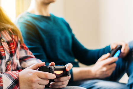 Portrait of him, her, two people, attractive, charming, cheerful, cheerful, positive, guy, lady, playing, online station, having fun, in, light, white, style, interior, hotel, houseの写真素材