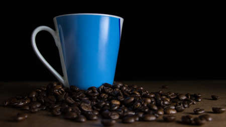 Cup of coffee with coffee beansの写真素材