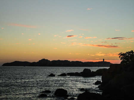 Sunset on the beach in Acapulco Mexicoの写真素材