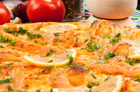 Delicious pizza with salmone and vegetablesの写真素材