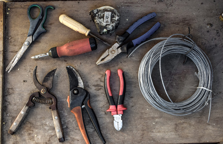 Old tools on the old workshop, wooden background, wooden tableの写真素材