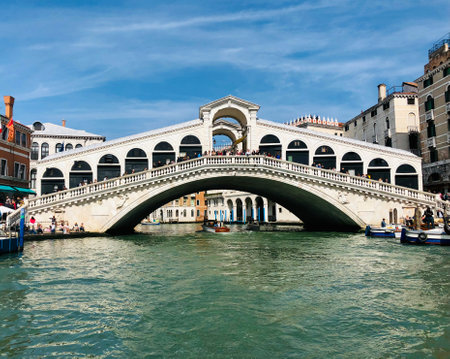 The Rialto Bridge is the oldest of the four bridges that span the Grand Canal in Venice and the most famous in Venice. Known as much for its design as for its history.の写真素材