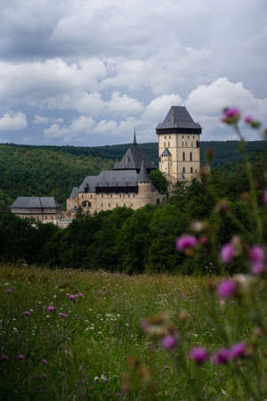 Karlstejn Castle, historical building of the Czech Republic in the summer blooming scenery. Popular tourist destination attraction near Prague.のeditorial素材