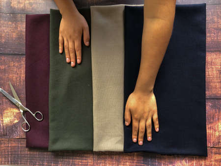 Hispanic woman working with fabrics