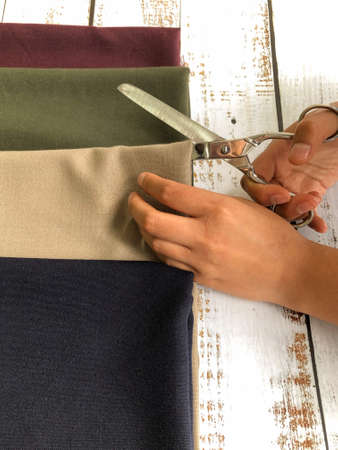 Hispanic woman working with fabrics