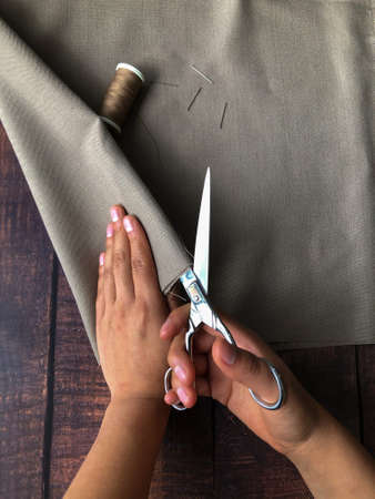 Hispanic woman working with fabricsの写真素材