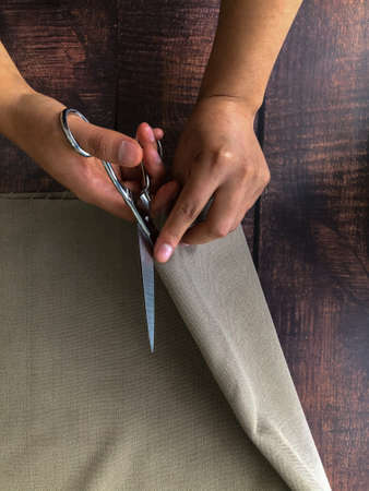 Hispanic woman working with fabricsの写真素材