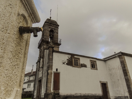 the church of San Salvador seen from the nearby water fountainの写真素材