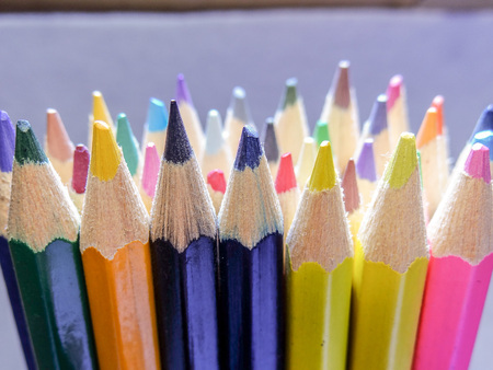 A handful of colored pencils waiting to be usedの写真素材