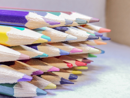 A handful of colored pencils waiting to be usedの写真素材
