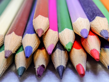A handful of colored pencils waiting to be usedの写真素材