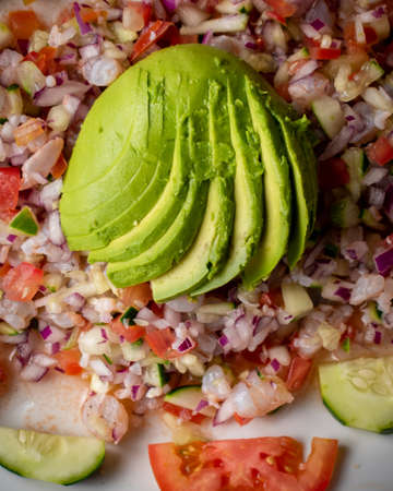 Mexican food, Fish ceviche dish, with avocado, tomato, onion and jalapenoの写真素材