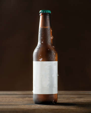 Cold beer bottle with dropsの写真素材