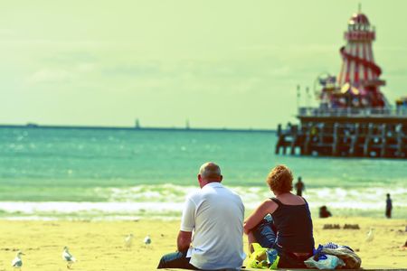 A couple enjoying bournemouth beach,cross processed with selective blurの写真素材