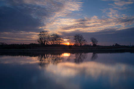 Blue Atmophere white sky and tree reflections