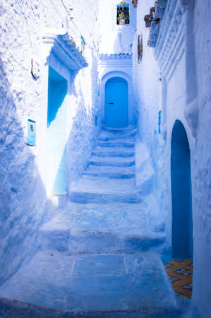 colorful blue street in the Moroccan city of Chaouenの写真素材