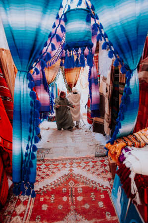 colorful street market in morocco. Sale of textiles on the streetの写真素材