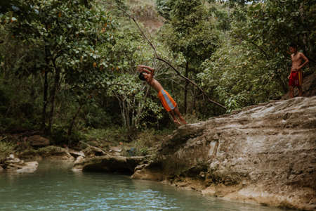 nature stamp with a beautiful waterfall on the island of bohol in the philippinesの写真素材