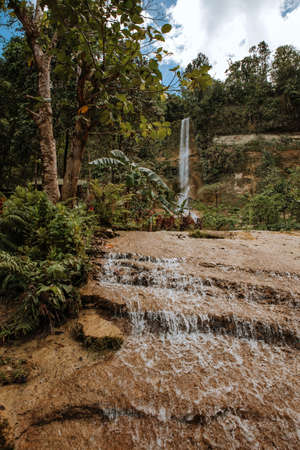 nature stamp with a beautiful waterfall on the island of bohol in the philippinesの写真素材