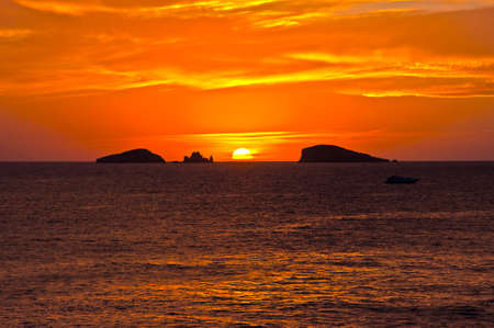 Es Vedra after the sunset, pastel colored sky at the mystic rock of Es Vedra, Ibiza Island.の写真素材