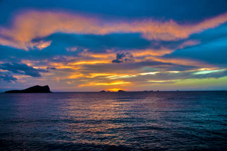 Es Vedra after the sunset, pastel colored sky at the mystic rock of Es Vedra, Ibiza Island.の写真素材