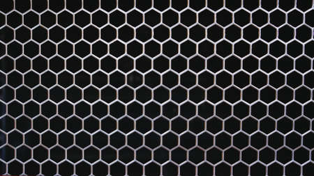 Close up of a car grill making a nice textured pattern