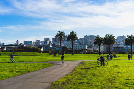 Bikers and locals walking on a sunny day in one of San Francisco's beautiful parks