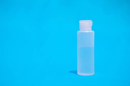 Transparent bottle with blue background
