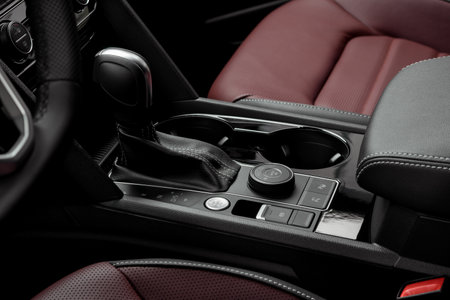 Luxury vehicle interior with red leather seats. start stop button and automatic gear leverの写真素材