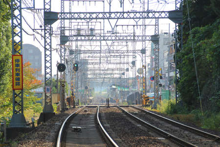 Looking down the tangle mess of metal of train tracks of a suburban train line in Nara, Japan のeditorial素材