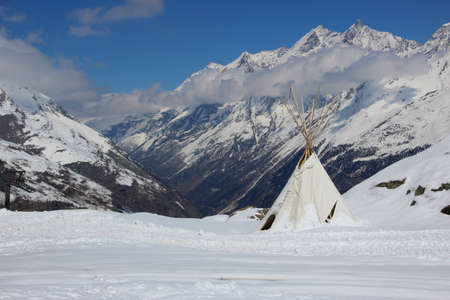 Indian style teepee tent set high up in the Swiss Alps の写真素材