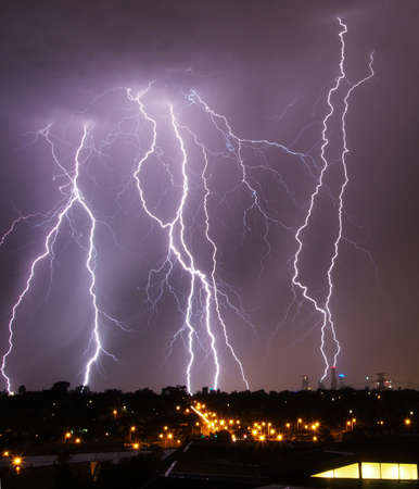 Lightning strikes over Melbourne city skylineの写真素材