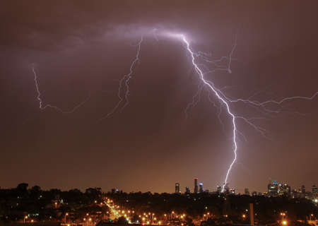 Lightning strikes over Melbourne city skylineの写真素材
