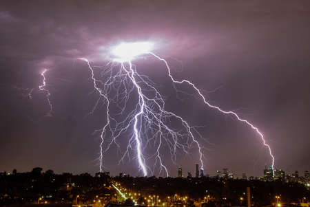 Lightning strikes over Melbourne city skylineの写真素材