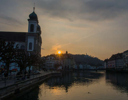Sunset at Jesuit Church by the River Reuss in Lucerneの写真素材