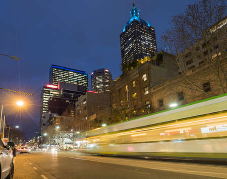 Melbourne city tram at night long exposure down city streetのeditorial素材
