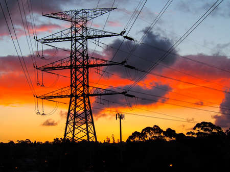 Electricity pylons and communication towerの写真素材