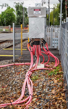 Danger High Voltage power electric cables running from transformerの写真素材