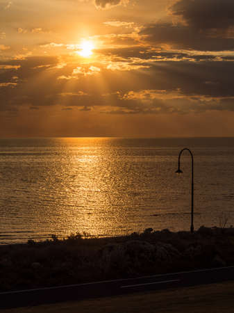 Port Philip Bay Light Silhouette as the Sun Sets, Melbourneの写真素材