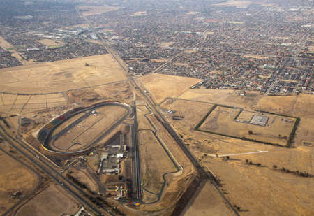 AUSTRALIA, MELBOURNE - MARCH 21, 2014: AUSTRALIA, MELBOURNE - MARCH 21, 2014: Aerial view of car racing track, Calder Park and surrounding suburbs.のeditorial素材
