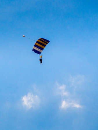 AUSTRALIA, MELBOURNE - January 02, 2015: Skydiver with colorful parachute decending to ground.のeditorial素材