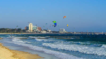 AUSTRALIA, MELBOURNE - OCTOBER 12, 2014: Many kite surfers in St Kilda on beautiful sunny day.のeditorial素材