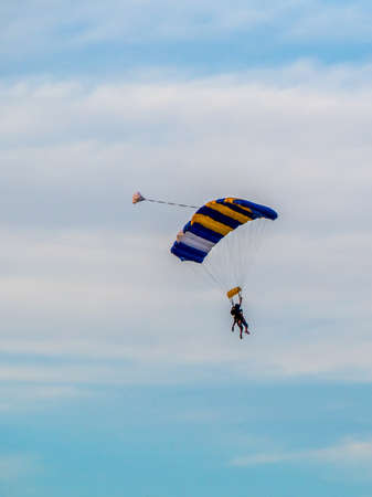AUSTRALIA, MELBOURNE - January 02, 2015: Skydiver with colorful parachute decending to ground.のeditorial素材